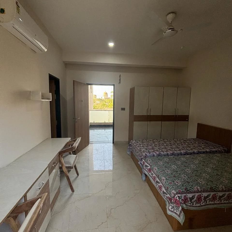 Spacious room with study desk and balcony