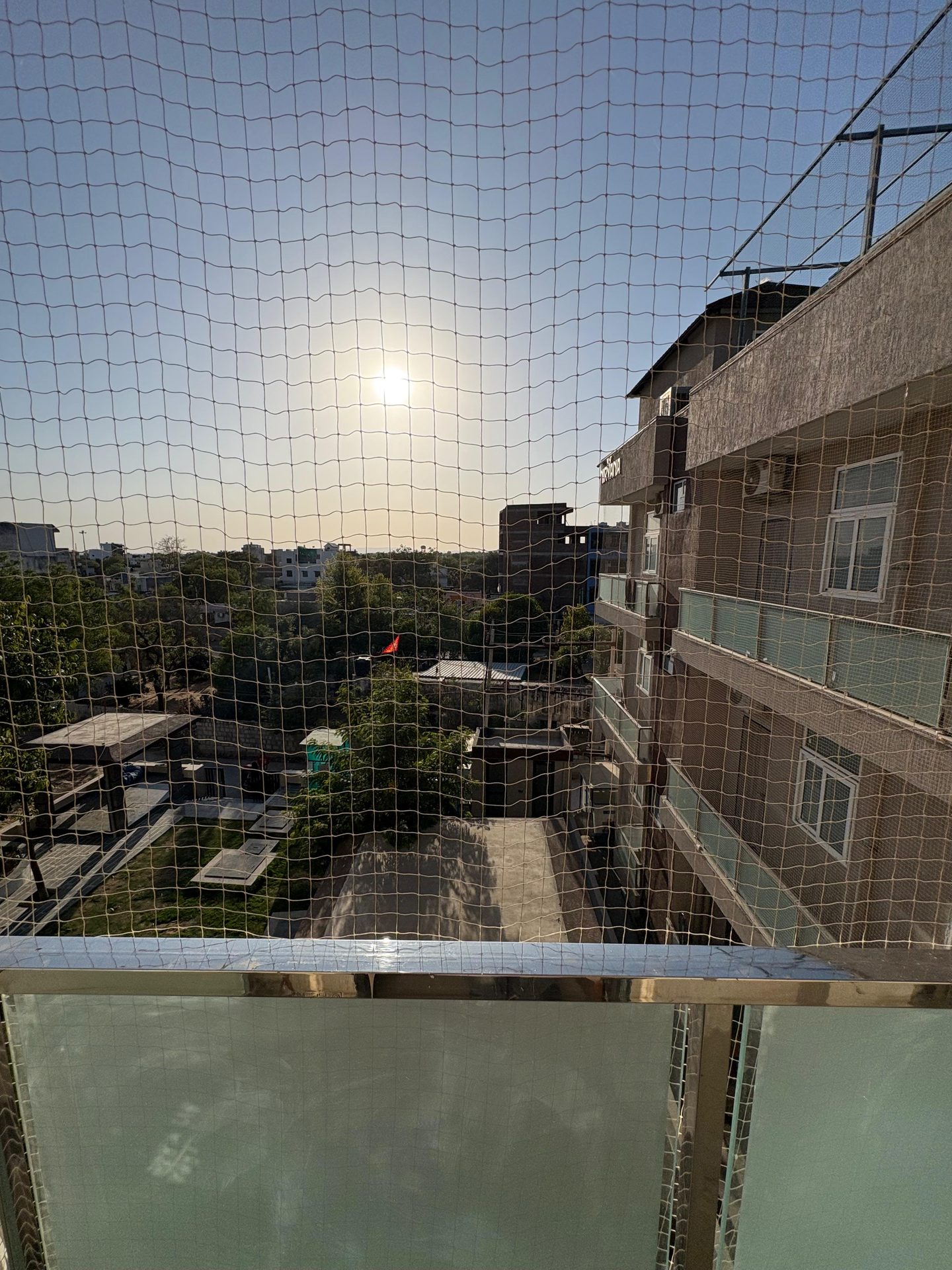 Balcony view toward the university at sunset