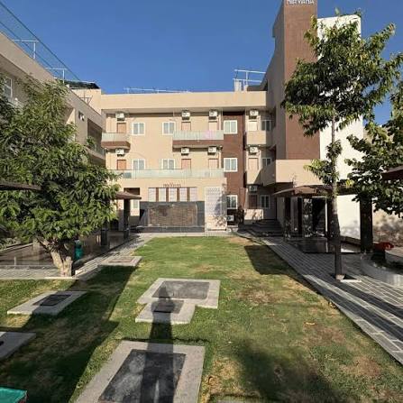 Nirvana Village girls hostel courtyard and green common area